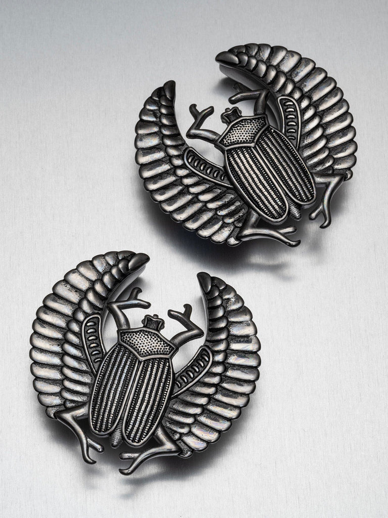 Scarab Crest Steel Saddles